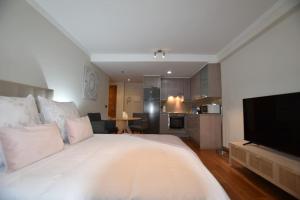 TV a/nebo společenská místnost v ubytování Apartamento pleno centro de Vigo