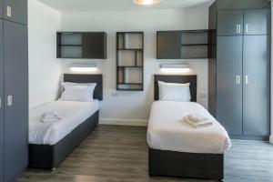 Rúm í herbergi á UCD Campus Accommodation