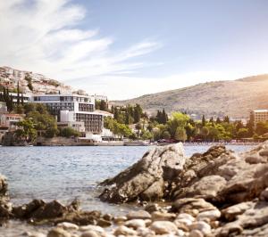 a view of a body of water with buildings at Hotel Kompas in Dubrovnik