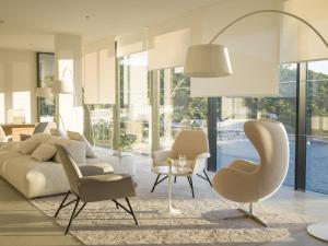a living room with a couch and chairs and a table at Hotel Kompas in Dubrovnik