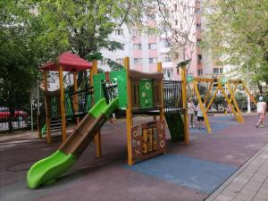 a playground with a slide in a park at Luxury 4-rooms, 2-bathrooms, Obor area in Bucharest