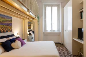 Postel nebo postele na pokoji v ubytování Titty House - Crocetta