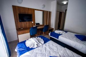Postel nebo postele na pokoji v ubytování Hotel Play