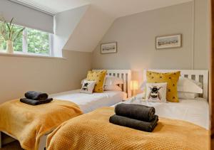 מיטה או מיטות בחדר ב-Dolphin Cottage