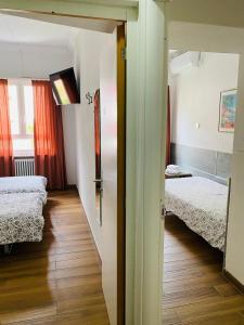 Katil atau katil-katil dalam bilik di Hotel Garni Montaldi