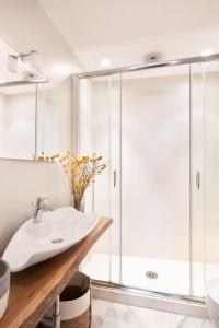 a bathroom with a sink and a shower at Idyllia - Cozy central retreat in Trastevere in Rome