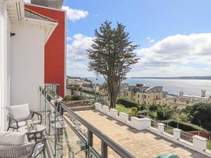 a balcony with a view of the water at Bay Sea View in Torquay