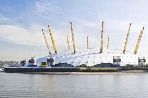 a large building in the middle of a body of water at 2 Bed Apartment, Near Canary Wharf, O2, Excel, Airport in London