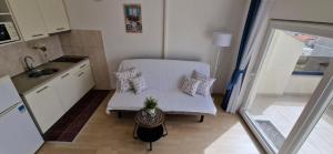 Kuchyň nebo kuchyňský kout v ubytování Apartmani Melia