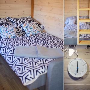 1 cama con almohadas y reloj en la habitación en Leśne Dziady Borsk, en Borsk