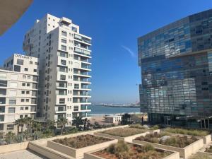 a view of two tall buildings and the ocean at Beautiful View on the sea at Casa-Marina in Casablanca