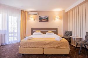 Postel nebo postele na pokoji v ubytování Casa Mureșan