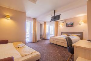 Postel nebo postele na pokoji v ubytování Casa Mureșan