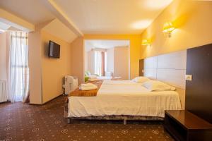 Postel nebo postele na pokoji v ubytování Casa Mureșan