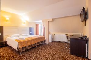 Postel nebo postele na pokoji v ubytování Casa Mureșan
