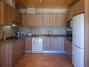 A kitchen or kitchenette at Quinta do Pomarinho with private pool