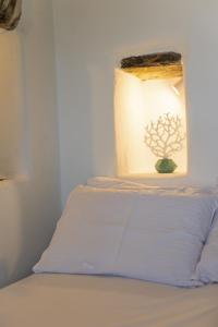 a bedroom with a bed with a lamp on it at The Architect's House, 3br villa in Naxos in Naxos Chora