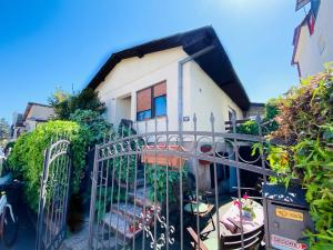 a gate in front of a house with plants at Vintage Apartment in Skopje