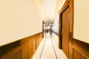 a corridor of a hospital hallway with a door at FabHotel Grand Boutique in New Delhi
