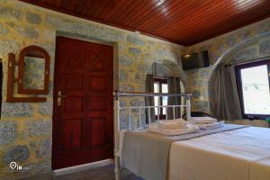 Letto o letti in una camera di 'Panorama' Stone House On The Beach