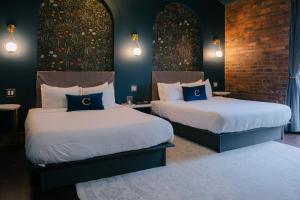 Voodi või voodid majutusasutuse The Chandler Hotel toas