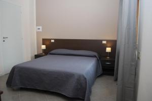 A bed or beds in a room at B&B Grandangolo