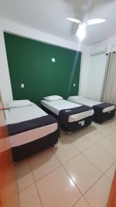 Ein Bett oder Betten in einem Zimmer der Unterkunft Quintal da Canastra - Room