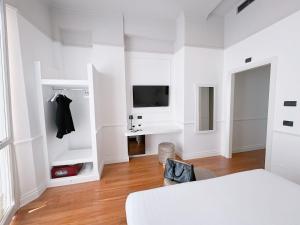 Postel nebo postele na pokoji v ubytování Rechigi Park Hotel