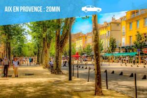 a poster of a street with trees in a city at Sariette - Spacieux - Linge hôtelier - Fibre - Confort in La Destrousse