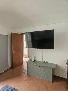 a flat screen tv hanging on a wall at Olivetti Home in Ivrea