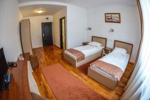 Postel nebo postele na pokoji v ubytování Hotel Posada