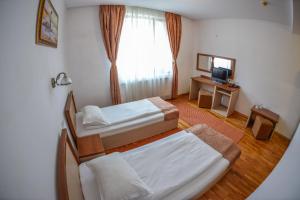 Postel nebo postele na pokoji v ubytování Hotel Posada