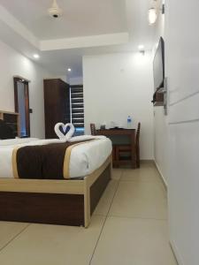 Postel nebo postele na pokoji v ubytování PAUL RESIDENCY