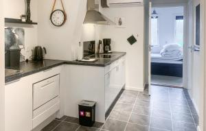 a kitchen with a sink and a counter top at Type 4 in Ebeltoft