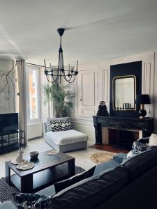 Posezení v ubytování L'Haussmanien au Coeur de ville