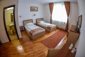 Postel nebo postele na pokoji v ubytování Hotel Posada