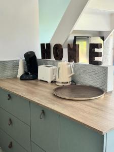 a kitchen counter with two toasters on top of it at Maison Au coeur d'Amboise in Amboise +9 photos