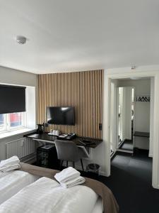 Postel nebo postele na pokoji v ubytování VISIONHOUSE Hotel
