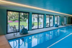 a swimming pool with a view of a house at Villa Artemisia by MyVillaCollection in Lenno