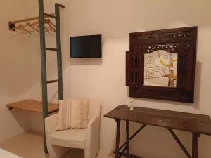 Televízia a/alebo spoločenská miestnosť v ubytovaní La casa degli artisti