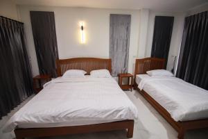 Postel nebo postele na pokoji v ubytování BK Hotel