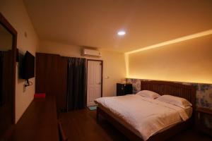 Postel nebo postele na pokoji v ubytování BK Hotel