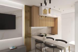 a kitchen with a sink and a counter with stools at Bellevue Luxury Apartment in Paralia Dionysiou