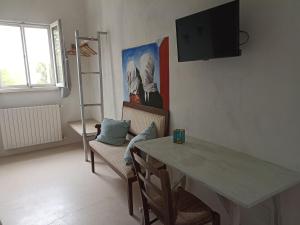 Televízia a/alebo spoločenská miestnosť v ubytovaní La casa degli artisti