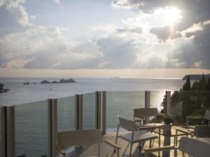 
a view from a balcony overlooking the ocean at Hotel Kompas in Dubrovnik
