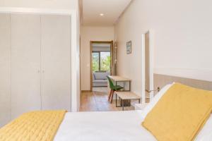 a bedroom with a bed and a desk at Akwabay - Les Villas du Cap in Le Lavandou