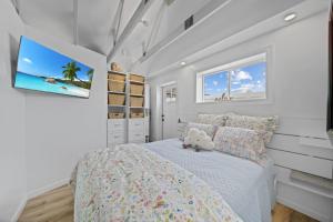 a bedroom with a bed with a teddy bear on it at Private Cottage on Annie in Coeur d'Alene