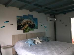 Postel nebo postele na pokoji v ubytování Aruba Local Stay