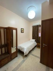 Una cama o camas en una habitación de Hostel Apart
