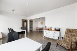 a living room with a table and chairs at Guesthouse Rauðafell in Holt